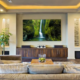 Custom lighting design Costa Rica in modern luxury living room with layered ceiling and ambient lighting